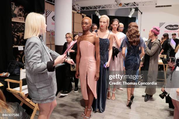 Models prepare backstage at Kia STYLE360 Hosts Helen Castillo New York S/S '18 Presented by ChapStick at Metropolitan West on September 12, 2017 in...