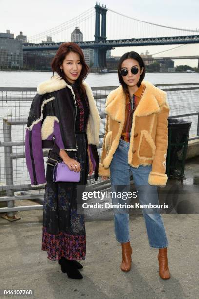 Park Shin-hye and Yoyo Cao attend Coach Spring 2018 fashion show during New York Fashion Week at Basketball City - Pier 36 - South Street on...