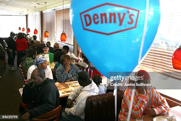 Customers fill the seats of a Denny's restaurant to receive a free Grand Slam breakfast February 3, 2009 in Emeryville, California. People lined up...