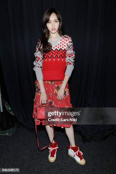 Tiffany Tang poses backstage during Coach Spring 2018 Fashion Show during New York Fashion Week at Basketball City - Pier 36 - South Street on...