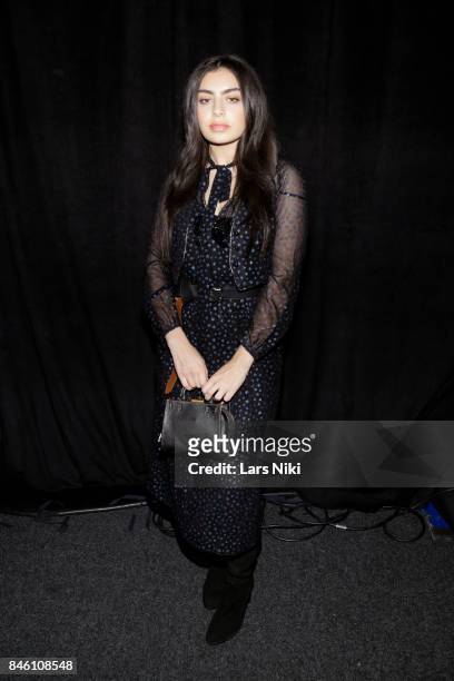 Singer Charli XCX poses backstage for Coach Spring 2018 fashion show during New York Fashion Week at Basketball City - Pier 36 - South Street on...