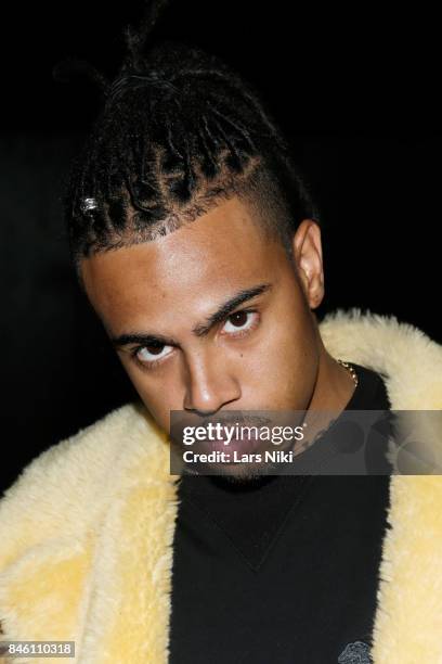 Rapper Vic Mensa poses backstage for Coach Spring 2018 fashion show during New York Fashion Week at Basketball City - Pier 36 - South Street on...