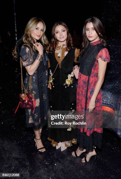 Cinta Laura Kiehl, Praiya Soandokmai, and Fazura attend Coach Spring 2018 fashion show during New York Fashion Week at Basketball City - Pier 36 -...