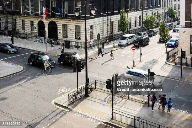 crossroad in london - guidare stock pictures, royalty-free photos & images