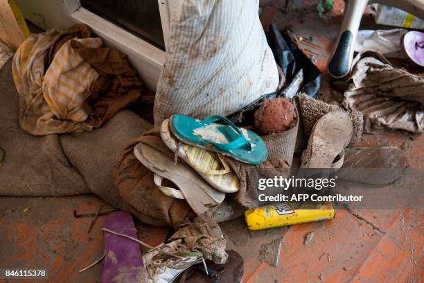 Damaged items from the trailer home of Patty Purdo are scattered on the ground in the aftermath of Hurricane Irma at the Seabreeze Trailer Park in...