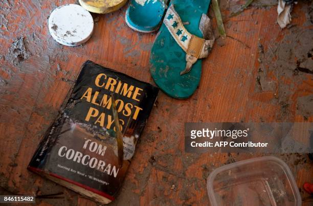 Damaged items from the trailer home of Patty Purdo are scattered on the ground in the aftermath of Hurricane Irma at the Seabreeze Trailer Park in...
