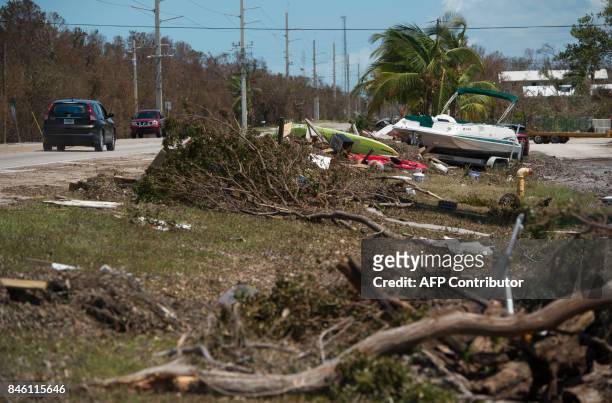 Debris from Hurricane Irma sits alongside US Highway 1 in Islamorada, in the Florida Keys, on September 12, 2017. / AFP PHOTO / SAUL LOEB