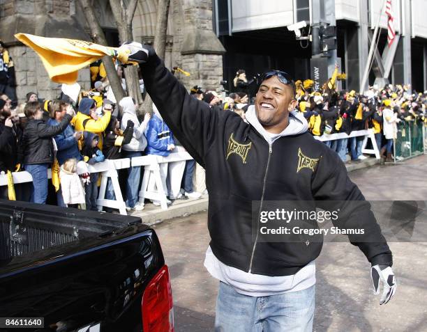 Lamarr Woodley of the Pittsburgh Steelers waves a terrible towel during a parade to celebrate winning Super Bowl XLIII on February 3, 2009 in...