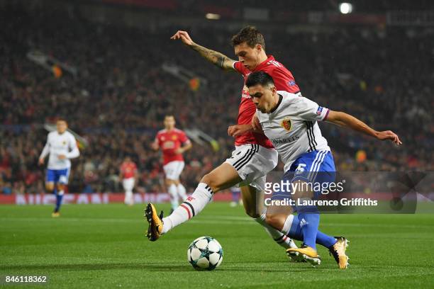 Victor Lindelof of Manchester United and Blas Riveros of FC Basel battle for possession during the UEFA Champions League Group A match between...