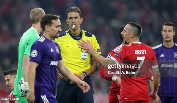 Referee Paolo Tagliavento shows the yellow card to Franck Ribery of Muenchen during the UEFA Champions League group B match between Bayern Muenchen...