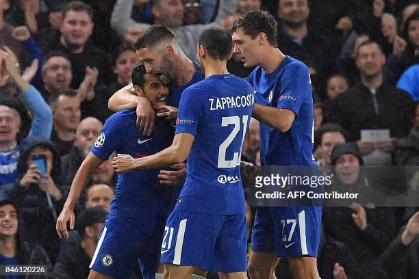 Chelsea's Spanish midfielder Pedro celebrates scoring the opening goal during the UEFA Champions League Group C football match between Chelsea and...