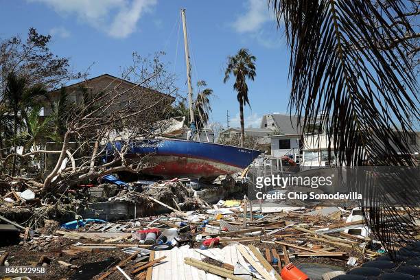 Boats, cars and other debris clog waterways in the Florida Keys two days after Hurricane Irma slammed into the state September 12, 2017 in Marathon,...