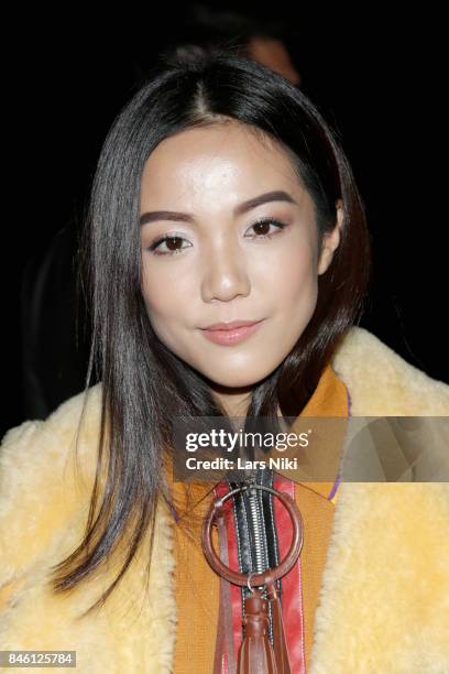 Designer Yoyo Cao attends Coach Spring 2018 fashion show during New York Fashion Week at Basketball City - Pier 36 - South Street on September 12,...