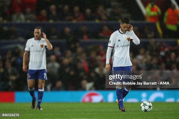 Dejected Luca Zuffi and Ricky van Wolfswinkel of FC Basel after the first goal during to the UEFA Champions League match between Manchester United...