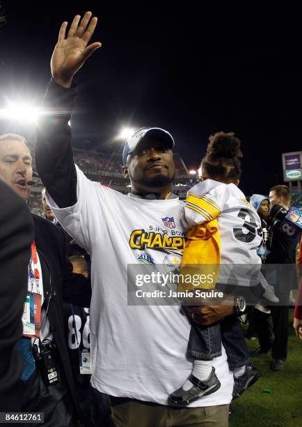 Head coach Mike Tomlin of the Pittsburgh Steelers holds his daughter Harlyn Quinn as he celebrates their 27-23 win against the Arizona Cardinals...