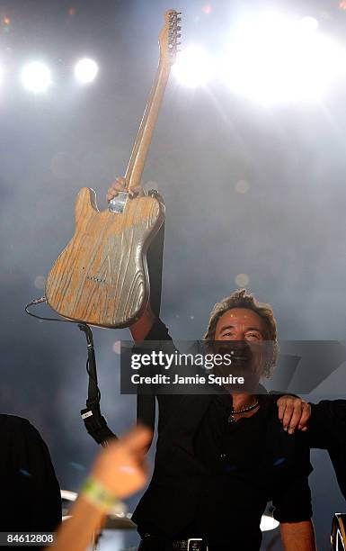 Musician Bruce Springsteen and the E Street Band perform at the Bridgestone halftime show during Super Bowl XLIII between the Arizona Cardinals and...