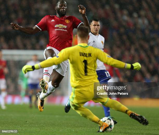 Romelu Lukaku of Manchester United in action with Tomas Vaclik of FC Basel during the UEFA Champions League group A match between Manchester United...