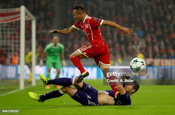 Thiago of Muenchen and Uro Spajic of Anderlecht battle for the ball during the UEFA Champions League group B match between Bayern Muenchen and RSC...