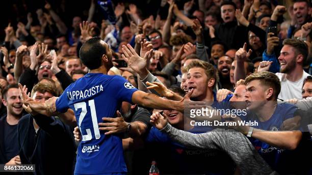 Davide Zappacosta of Chelsea celebrates scoring his sides second goal with the Chelsea fans during the UEFA Champions League Group C match between...