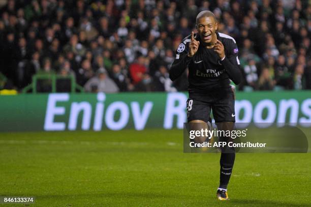 Paris Saint-Germain's French striker Kylian Mbappe celebrates after scoring their second goal during the UEFA Champions League Group B football match...