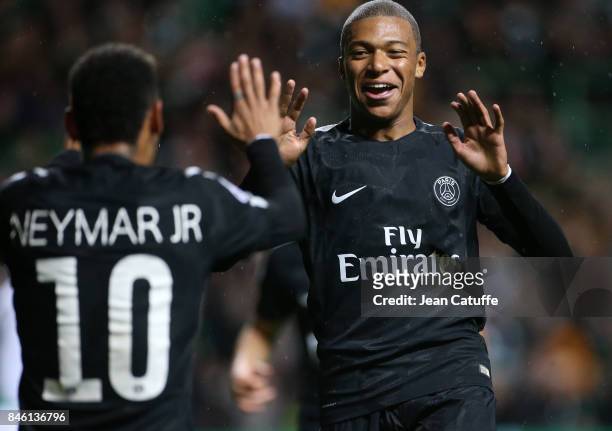 Kylian Mbappe of PSG celebrates his goal with Neymar Jr during the UEFA Champions League match between Celtic Glasgow and Paris Saint Germain at...