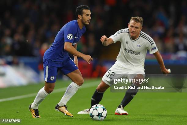 Pedro of Chelsea attempts to get past Jakub Rzezniczak of Qarabag FK during the UEFA Champions League Group C match between Chelsea FC and Qarabag FK...