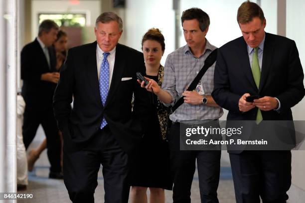 Sens. Richard Burr and Mark Warner enter a meeting of the Senate Intelligence Committee on Capitol Hill September 7, 2017 in Washington, DC. The...