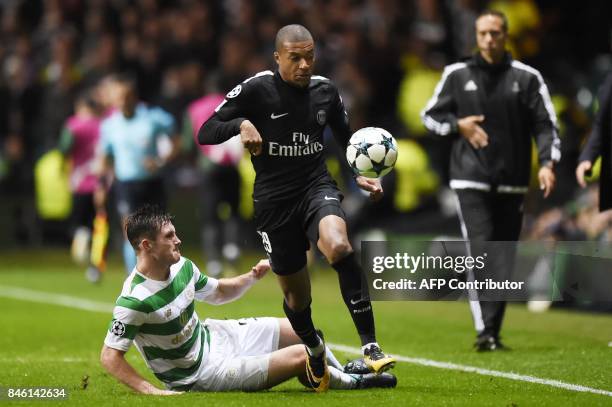 Paris Saint-Germain's French striker Kylian Mbappe runs away from Celtic's Scottish defender Anthony Ralston during the UEFA Champions League Group B...