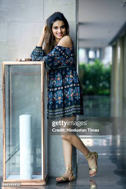 Bollywood actress Nidhhi Agerwal poses for photograph during promotion of her film Munna Michael at Roseate House Hotel on July 18, 2017 in New...