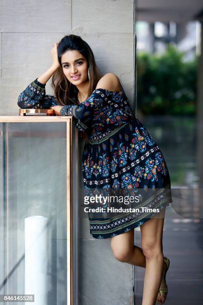 Bollywood actress Nidhhi Agerwal poses for photograph during promotion of her film Munna Michael at Roseate House Hotel on July 18, 2017 in New...