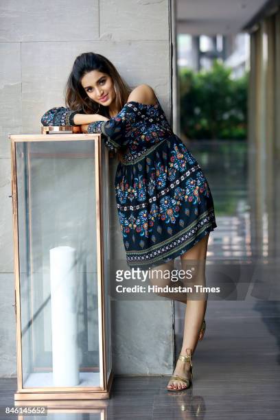 Bollywood actress Nidhhi Agerwal poses for photograph during promotion of her film Munna Michael at Roseate House Hotel on July 18, 2017 in New...
