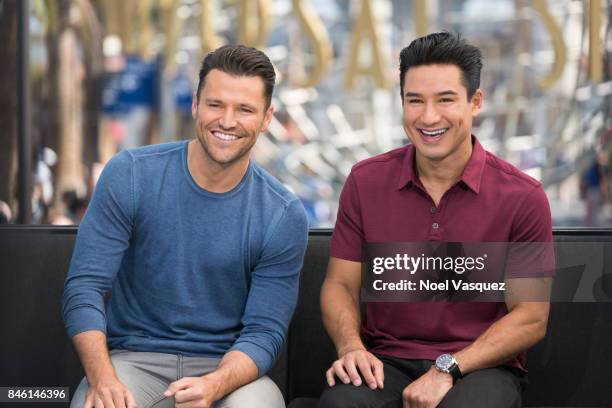 Mark Wright and Mario Lopez visit "Extra" at Universal Studios Hollywood on September 12, 2017 in Universal City, California.