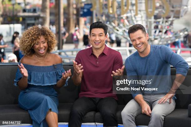 Tanika Ray, Mario Lopez and Mark Wright visit "Extra" at Universal Studios Hollywood on September 12, 2017 in Universal City, California.