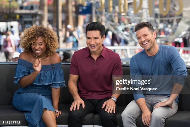 Tanika Ray, Mario Lopez and Mark Wright visit "Extra" at Universal Studios Hollywood on September 12, 2017 in Universal City, California.