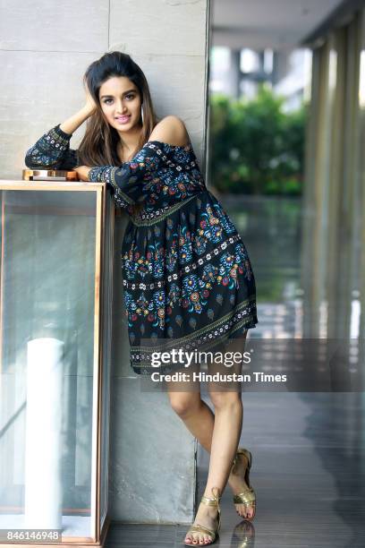 Bollywood actress Nidhhi Agerwal poses for photograph during promotion of her film Munna Michael at Roseate House Hotel on July 18, 2017 in New...