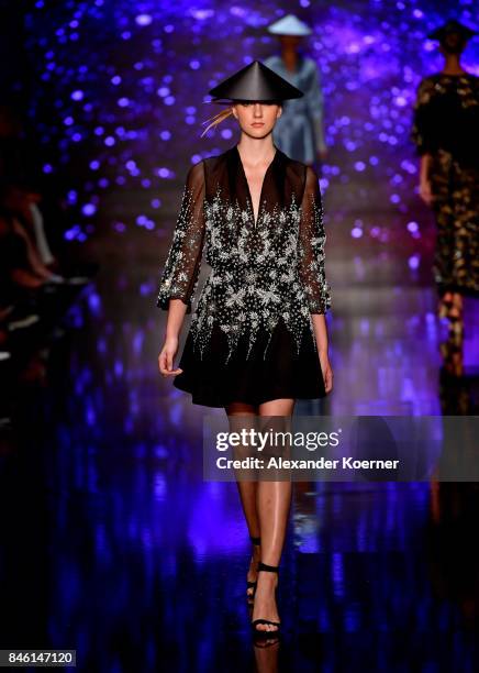 Model walks the runway at the Ozgur Masur show during Mercedes-Benz Istanbul Fashion Week September 2017 at Zorlu Center on September 12, 2017 in...