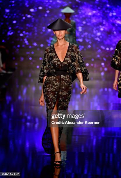 Model walks the runway at the Ozgur Masur show during Mercedes-Benz Istanbul Fashion Week September 2017 at Zorlu Center on September 12, 2017 in...