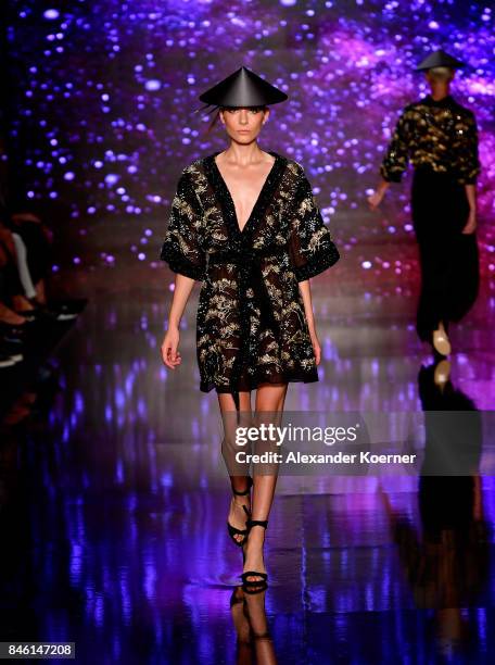 Model walks the runway at the Ozgur Masur show during Mercedes-Benz Istanbul Fashion Week September 2017 at Zorlu Center on September 12, 2017 in...