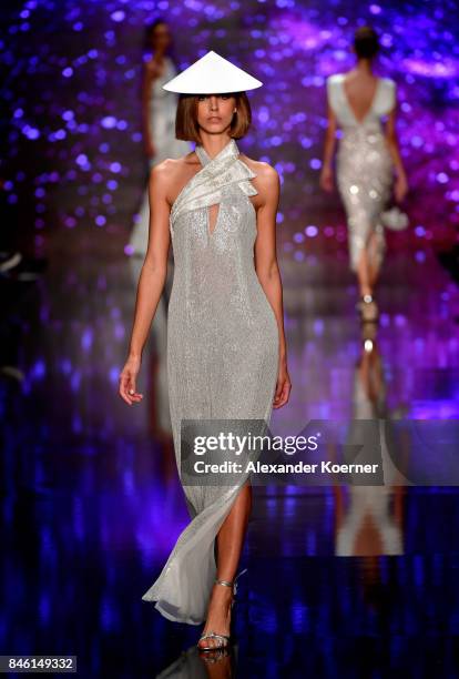 Model walks the runway at the Ozgur Masur show during Mercedes-Benz Istanbul Fashion Week September 2017 at Zorlu Center on September 12, 2017 in...