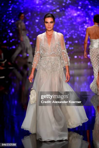 Model walks the runway at the Ozgur Masur show during Mercedes-Benz Istanbul Fashion Week September 2017 at Zorlu Center on September 12, 2017 in...