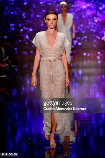 Model walks the runway at the Ozgur Masur show during Mercedes-Benz Istanbul Fashion Week September 2017 at Zorlu Center on September 12, 2017 in...