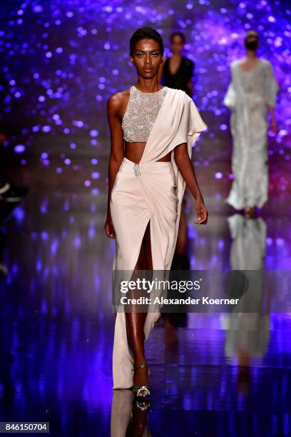 Model walks the runway at the Ozgur Masur show during Mercedes-Benz Istanbul Fashion Week September 2017 at Zorlu Center on September 12, 2017 in...