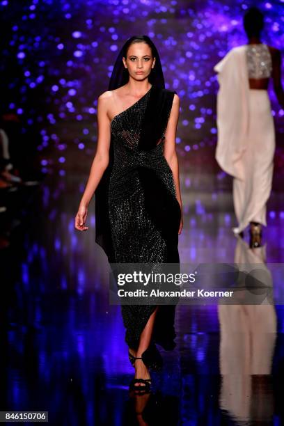 Model walks the runway at the Ozgur Masur show during Mercedes-Benz Istanbul Fashion Week September 2017 at Zorlu Center on September 12, 2017 in...