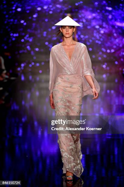 Model walks the runway at the Ozgur Masur show during Mercedes-Benz Istanbul Fashion Week September 2017 at Zorlu Center on September 12, 2017 in...