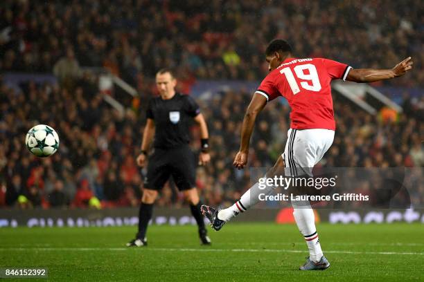 Marcus Rashford of Manchester United scores his sides third goal during the UEFA Champions League Group A match between Manchester United and FC...