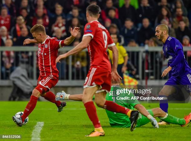 Bayern Munich's German midfielder Joshua Kimmich scores the third goal past Anderlecht's Belgian goalkeeper Matz Sels during the Champions League...