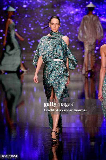 Model walks the runway at the Ozgur Masur show during Mercedes-Benz Istanbul Fashion Week September 2017 at Zorlu Center on September 12, 2017 in...