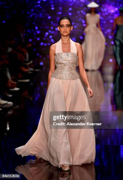 Model walks the runway at the Ozgur Masur show during Mercedes-Benz Istanbul Fashion Week September 2017 at Zorlu Center on September 12, 2017 in...