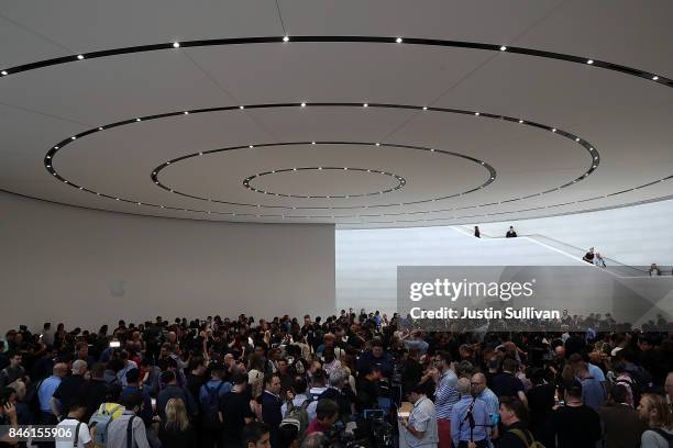 Attendees look at new Apple products during an Apple special event at the Steve Jobs Theatre on the Apple Park campus on September 12, 2017 in...