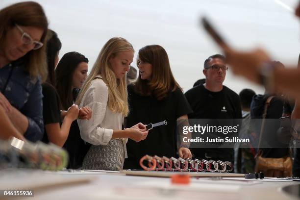 Attendees inspect the new Apple Watch Series 3 during an Apple special event at the Steve Jobs Theatre on the Apple Park campus on September 12, 2017...